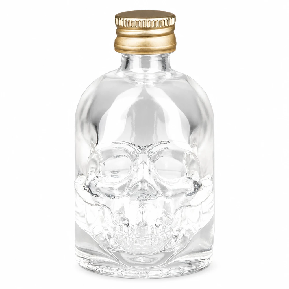 Bouteille en verre 50 ml « Hector » et bouchon à vis doré UNiTWIST® Bouteille en verre Hector de 50 ml avec design de tête de mort et bouchon à vis doré UNiTWIST pour spiritueux et boissons