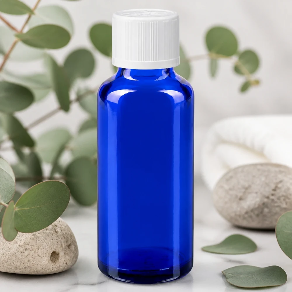 Flacon à pharmacie bleu 30ml bouchon anti-goutte blanc séc. enf. std Flacon en verre bleu de 30 ml avec bouchon à vis à sécurité enfant et compte-gouttes de 1,2 mm pour huiles essentielles