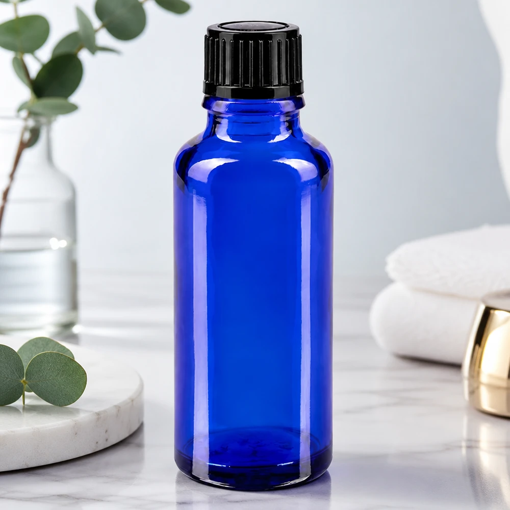 Flacon de pharmacie bleu de 30 ml en verre anti-UV, muni d'un bouchon noir de 11 mm