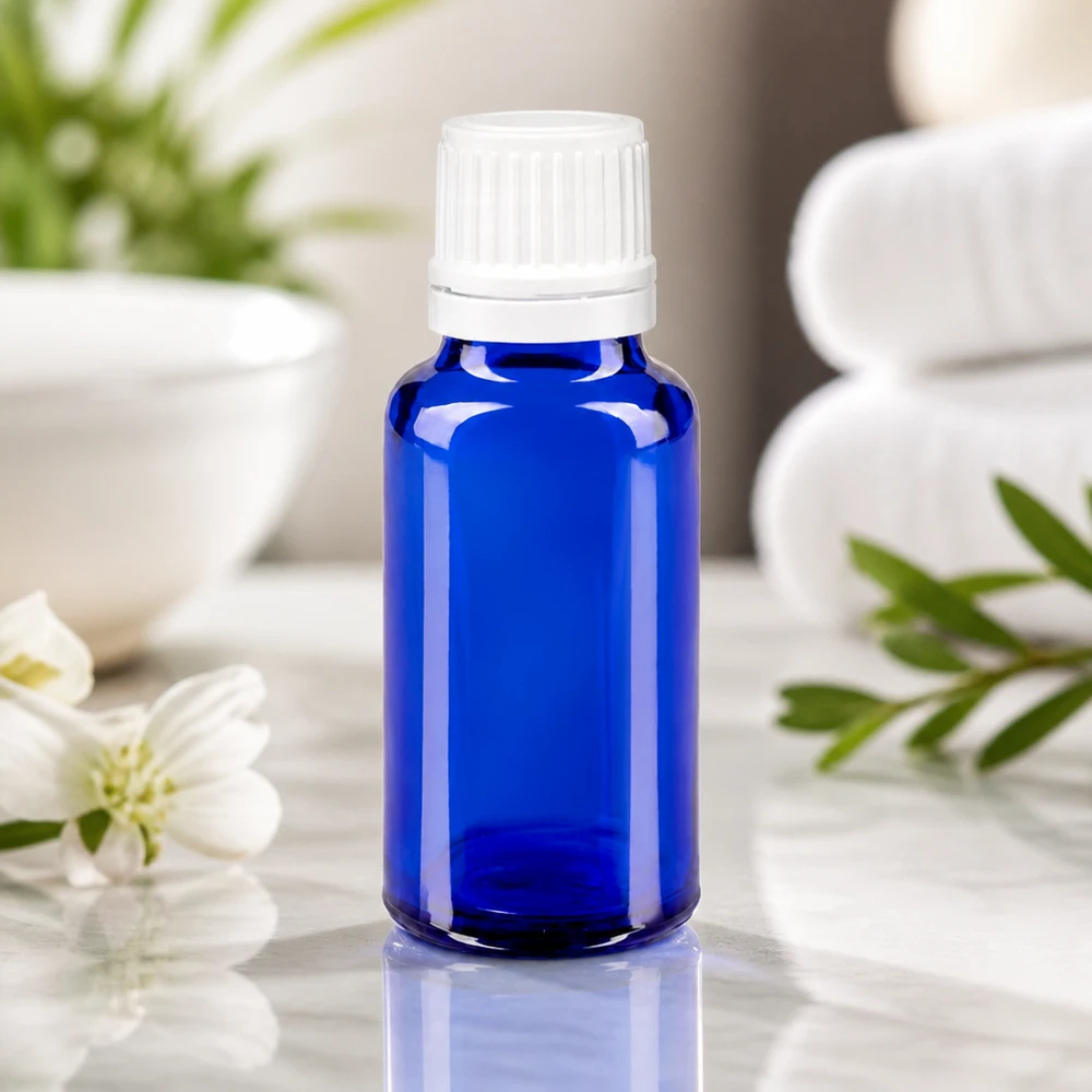 Flacon en verre bleu de 20 ml avec compte-gouttes de 0,7 mm, idéal pour conserver des cosmétiques naturels et des essences