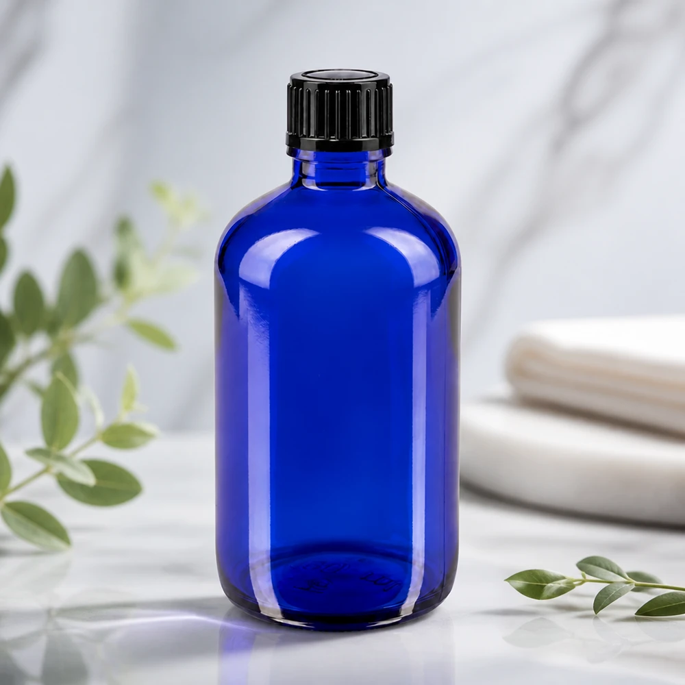 Flacon compte-gouttes ApoGlas bleu cobalt de 100 ml avec insert de 1 mm, destiné à la pharmacie et aux cosmétiques naturels