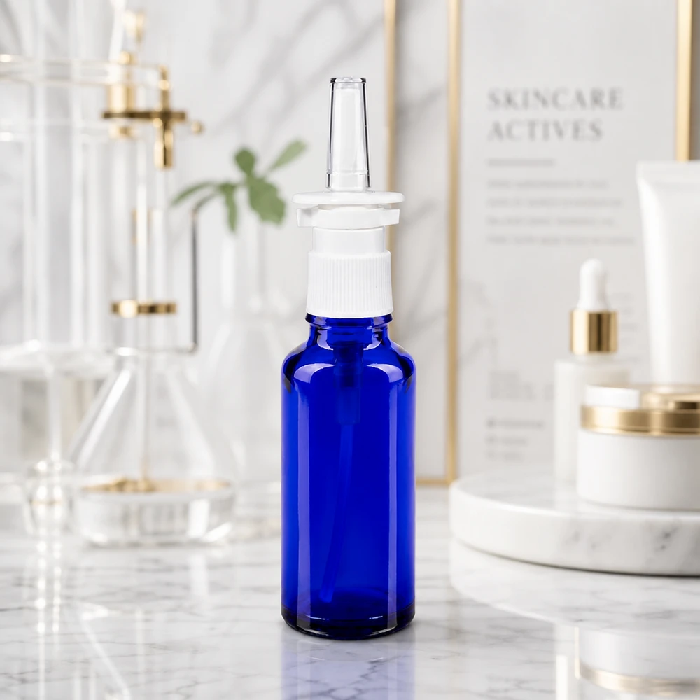 Flacon de pharmacie bleu 30ml vaporisateur nasal blanc Flacon de spray nasal en verre d'apothicaire de 30 ml, en verre bleu anti-UV avec embout pulvérisateur transparent