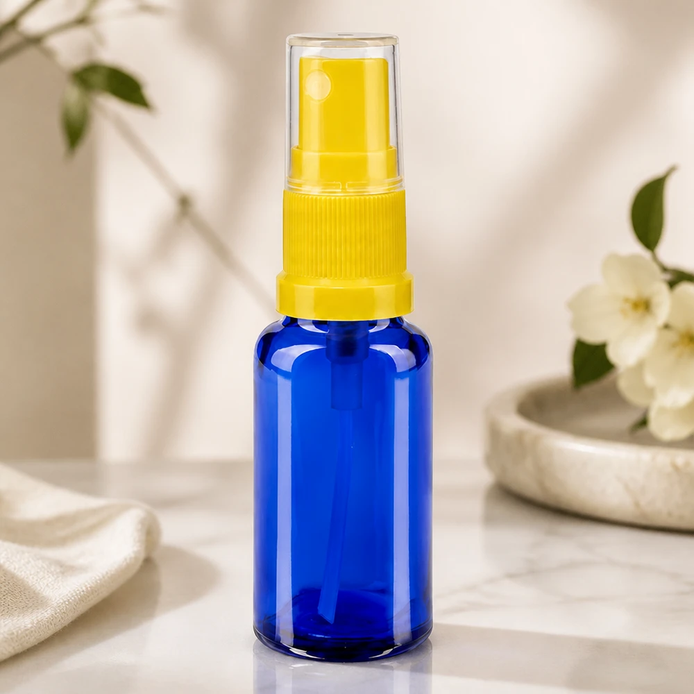 Flacon en verre opaque de 20 ml avec vaporisateur, de couleur jaune, destiné aux secteurs cosmétique et pharmaceutique