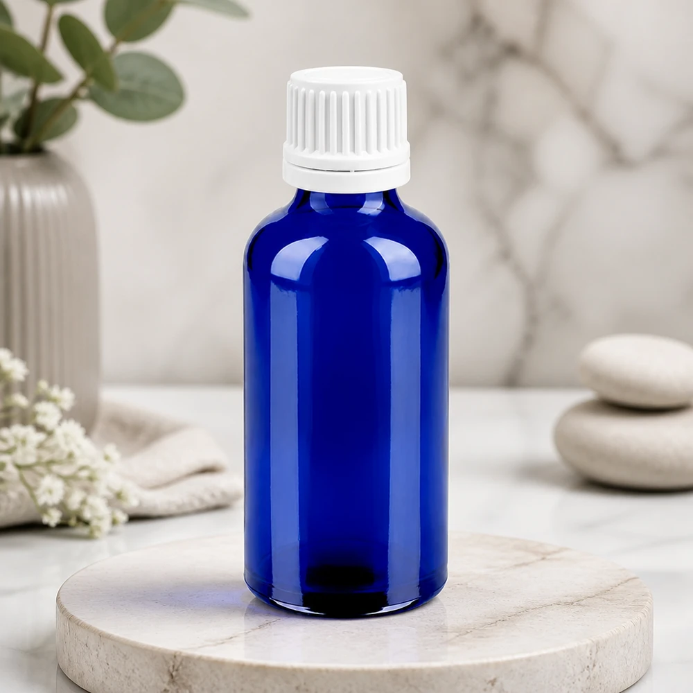 Flacon compte-goutte 50ml 0.7mm blanc OV BlueLine UT18/50 Flacon pratique en verre bleu de 50 ml avec embout compte-gouttes blanc ergonomique pour une utilisation facile