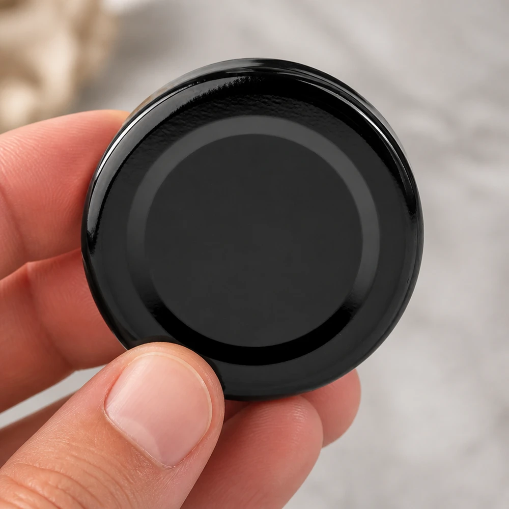 Couvercle BasicSeal noir de 43 mm (TO43) UNiTWIST Couvercle métallique TO43 BasicSeal de 43 mm, noir brillant, UNiTWIST – Vue de dessus à vol d'oiseau