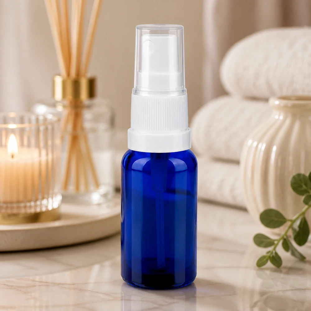Vaporisateur 20ml blanc/tr. STD BlueLine UT18/20 Petit vaporisateur d'huiles essentielles en verre bleu foncé de 20 ml avec une fine pulvérisation
