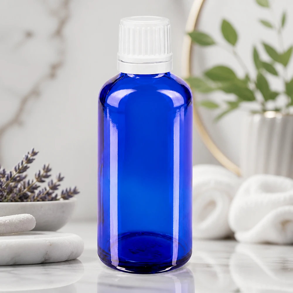Flacon à pharmacie bleu 50ml bouchon inviolable 1.2mm blanc bouchon d'inviolabilité Flacon compte-gouttes bleu cobalt de 50 ml en verre ApoGlas de haute qualité, avec bouchon OV de 0,7 mm