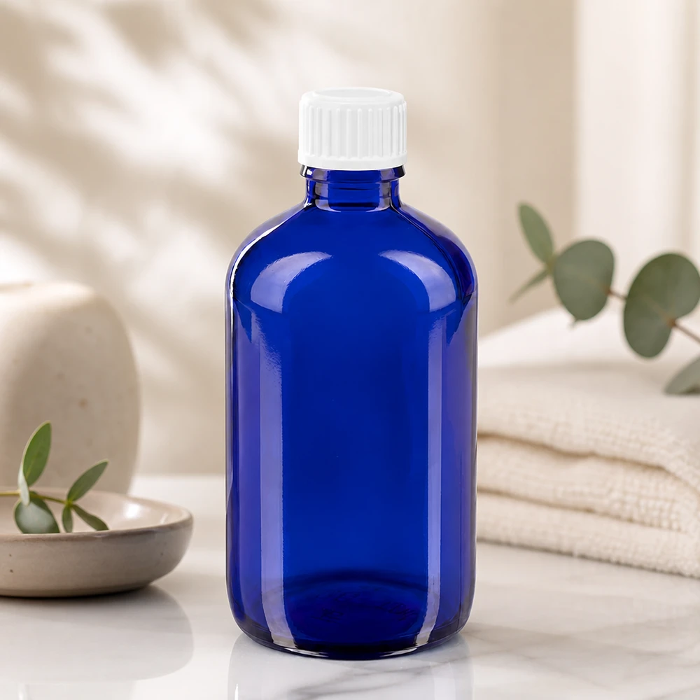 Flacon ApoGlas de 100 ml, bleu, avec un embout compte-gouttes précis de 0,9 mm pour un dosage exact