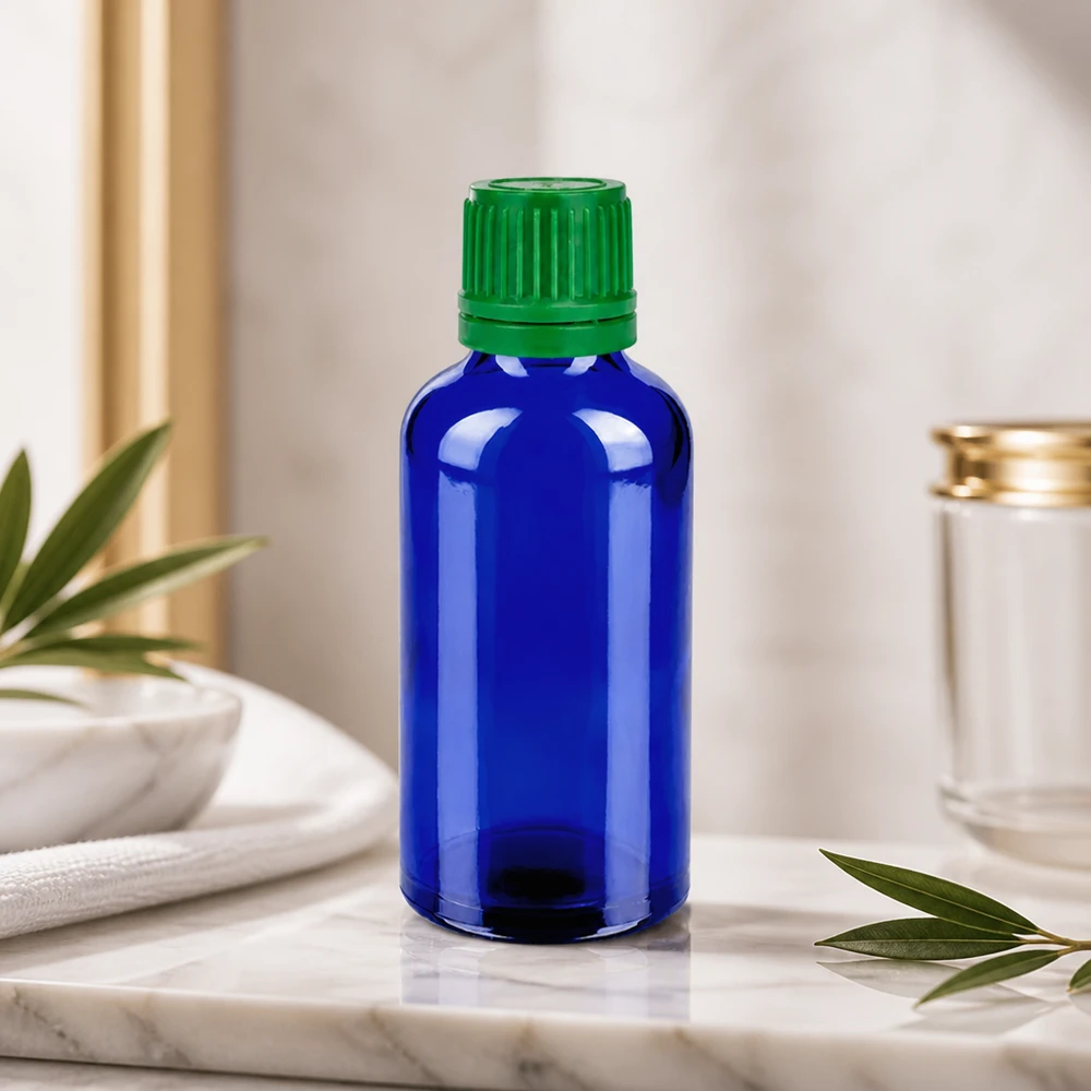 Flacon 50ml 11mm SV vert OV BlueLine UT18/50 Bouteille design moderne de 50 ml en bleu cobalt avec bouchon ergonomique vert pour l'aromathérapie