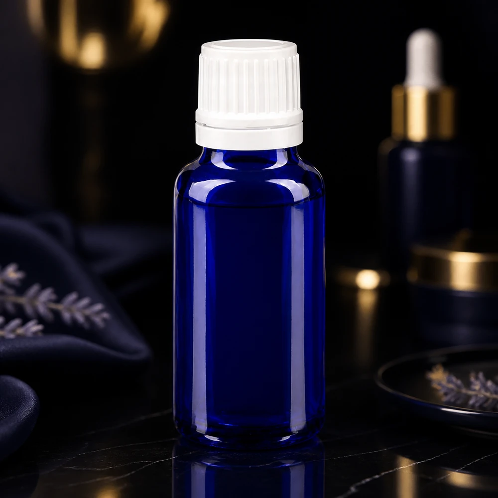 Flacon compte-gouttes bleu cobalt de 20 ml en verre d'apothicaire, muni d'un bouchon OV blanc à sécurité enfants