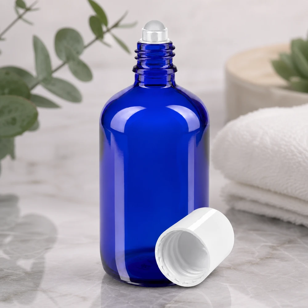 Flacon en verre d'apothicaire bleu de 100 ml avec applicateur à bille pour huiles essentielles et parfums