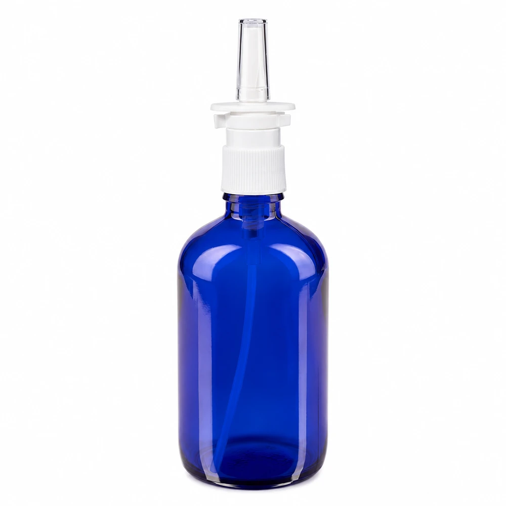 Flacon en verre bleu de 100 ml avec embout pulvérisateur nasal blanc transparent, destiné aux pharmacies
