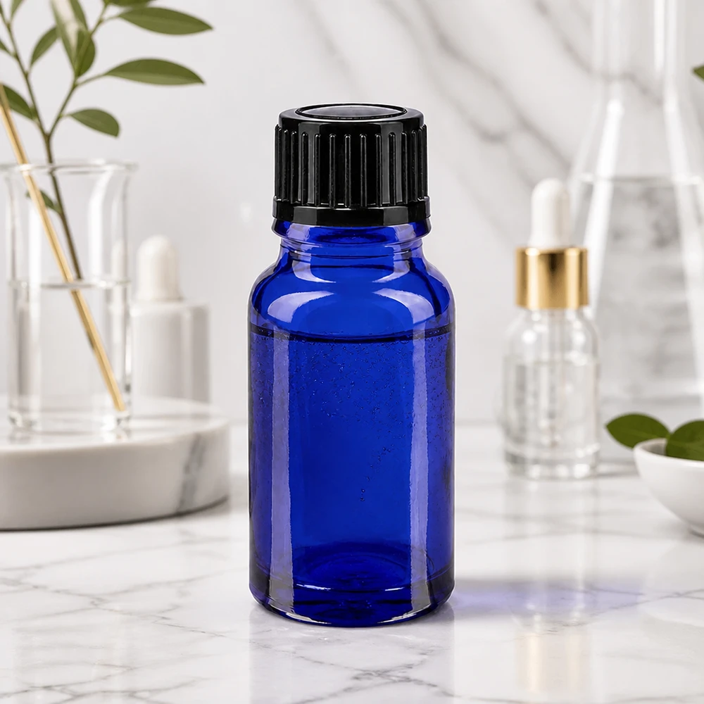 Flacon de pharmacie bleu 10ml, noir 1mm std Flacon de pharmacie avec protection UV, 10 ml, bleu cobalt, muni d'un bouchon compte-gouttes noir à sécurité enfant