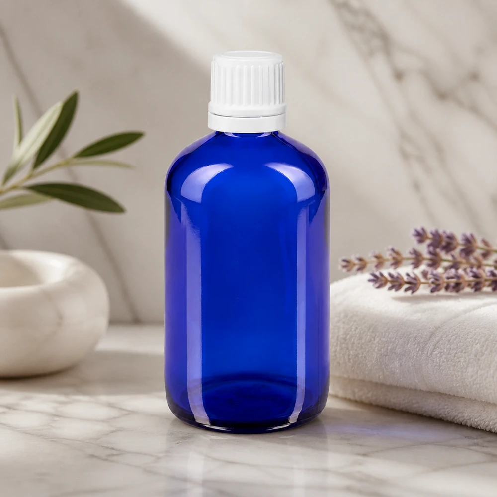 Flacon en verre bleu cobalt de 100 ml avec bouchon à vis à sécurité enfant pour huiles essentielles