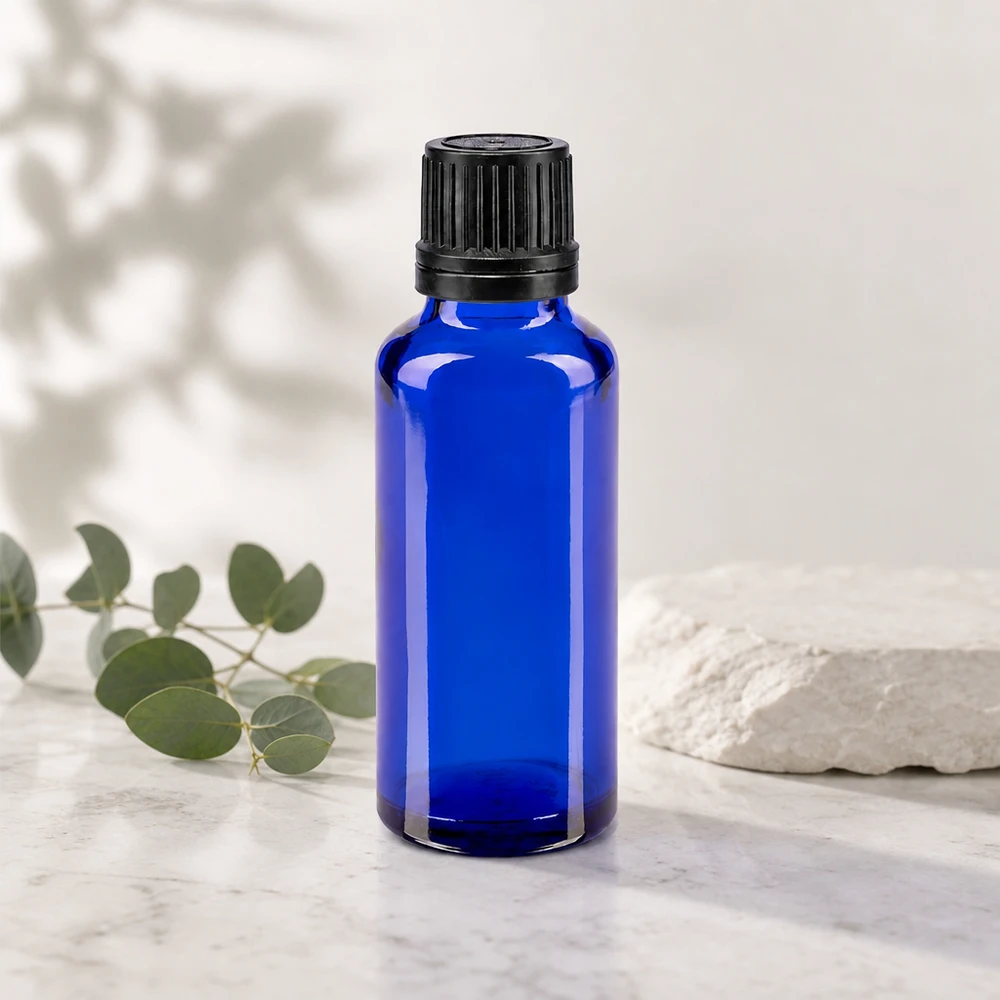 Flacon de pharmacie bleu de 30 ml avec verre anti-UV et bouchon doseur de précision de 1 mm
