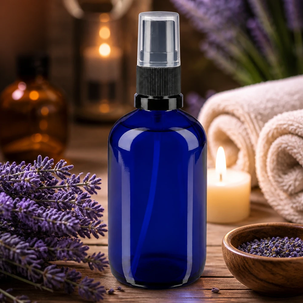 Flacon en verre bleu cobalt de 100 ml avec vaporisateur à pompe, anneau noir et bouchon transparent