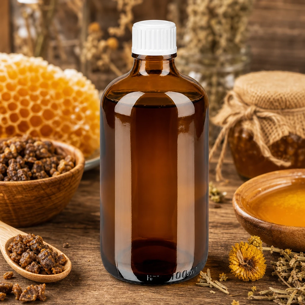 Flacon de pharmacie brun 100ml bouchon vissable blanc Std Flacon en verre brun de 100 ml muni d'un bouchon blanc de 11 mm, à côté de cire d'abeille et d'herbes séchées