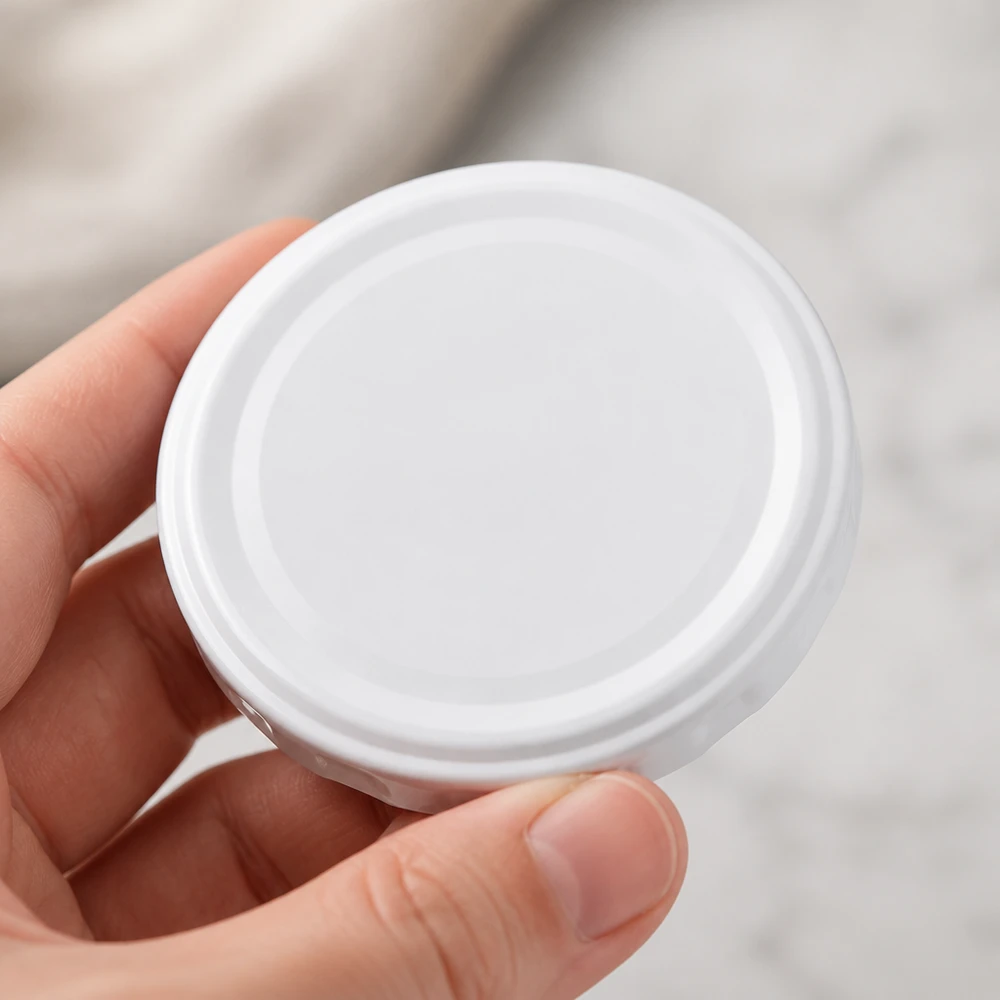 Couvercle BasicSeal 58 mm blanc (TO58deep) UNiTWIST Couvercle BasicSeal 58 mm TO58deep UNiTWIST, revêtement blanc, adapté au contact alimentaire, pour bocaux de conserve