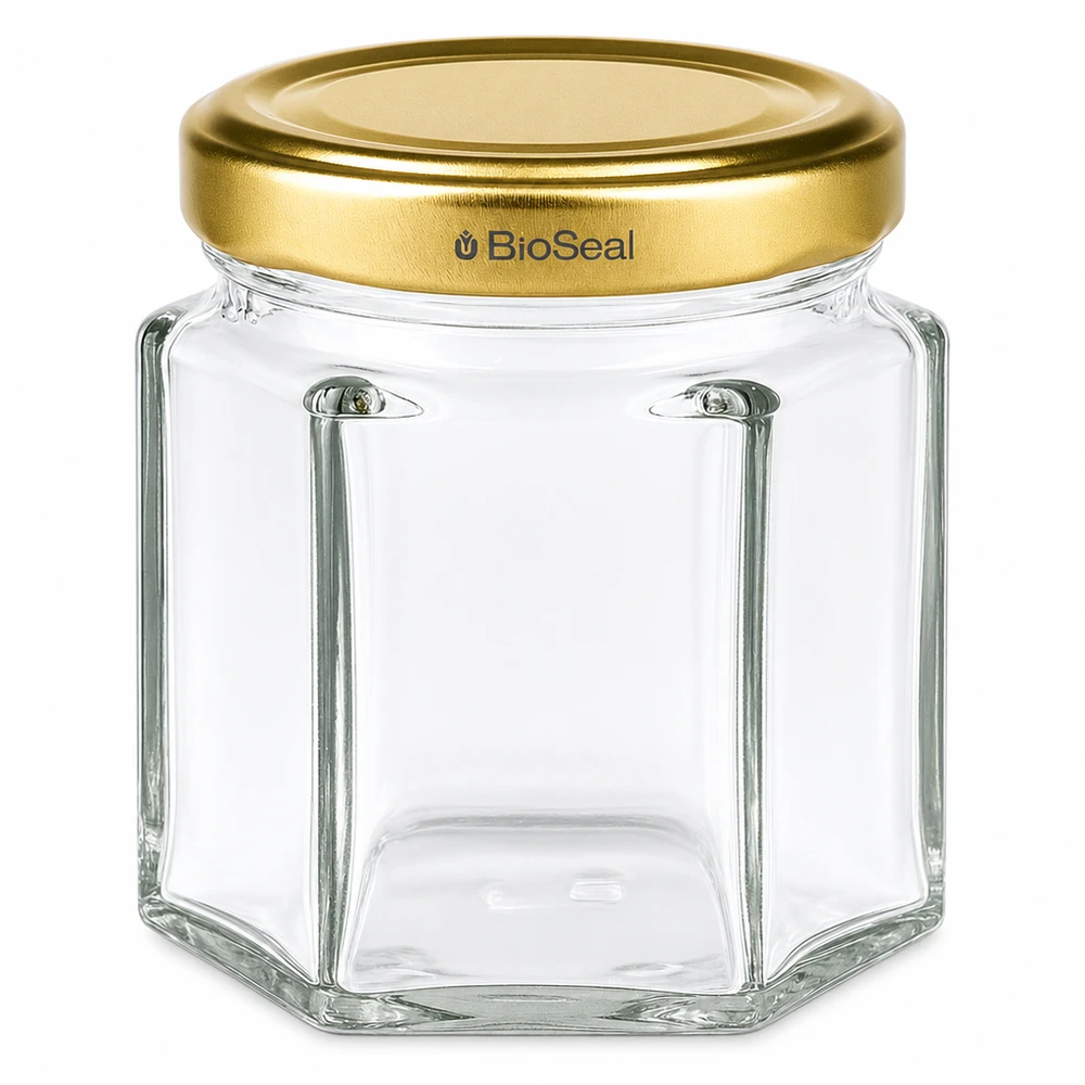 Pot à miel 60 g avec couvercle doré BioSeal UNiTWIST Pot à miel hexagonal de 60g avec couvercle doré à visser BioSeal UNiTWIST pour miel et confiture