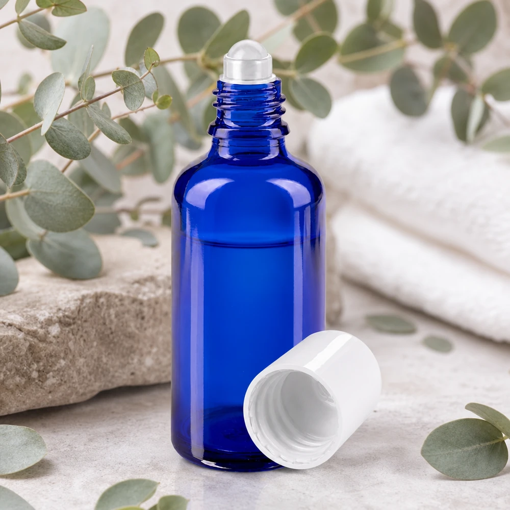 Flacon roll-on de 50 ml en verre bleu cobalt pour huiles essentielles, avec bouchon à vis blanc
