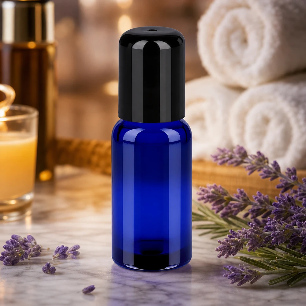 Flacon Roll-On 20ml noir STD BlueLine UT18/20 Flacon en verre bleu de 20 ml avec système de bille roulante pour un dosage hygiénique et économique