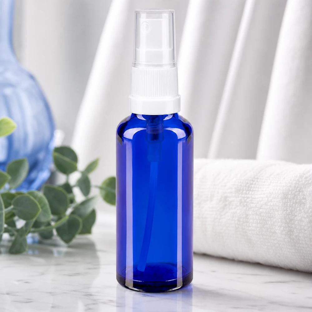 Vaporisateur en verre bleu de 10 ml avec pompe blanche, pour huiles essentielles et sérums