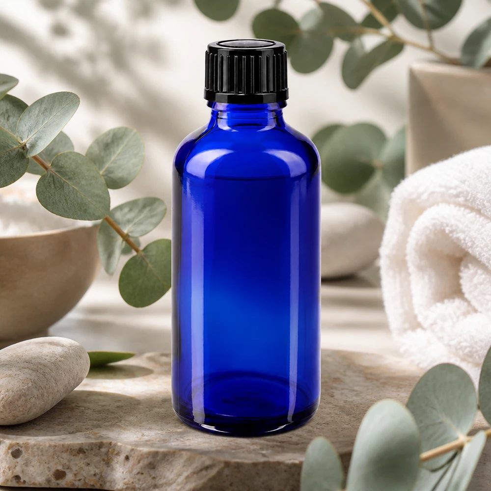 Flacon de pharmacie bleu 50ml bouchon vissable noir std Flacon en verre bleu cobalt de 50 ml, modèle standard avec bouchon de 11 mm, dans un cadre de spa et de bien-être